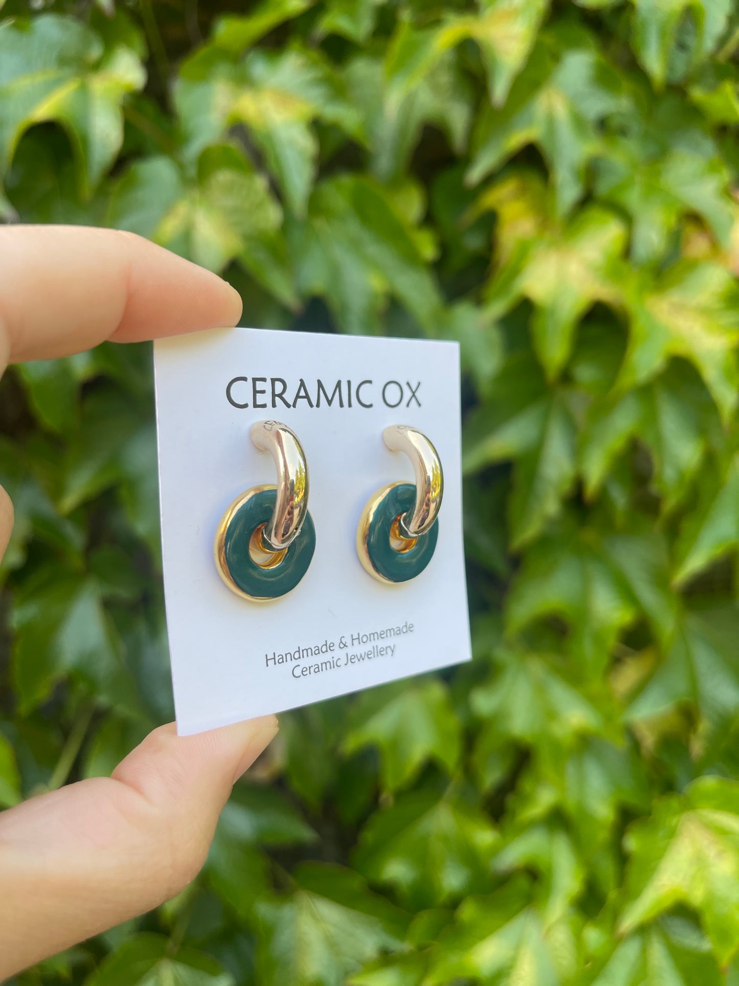 Teal circles on chunky golden hoops