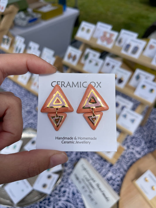 Pink coral triangles in triangles studs
