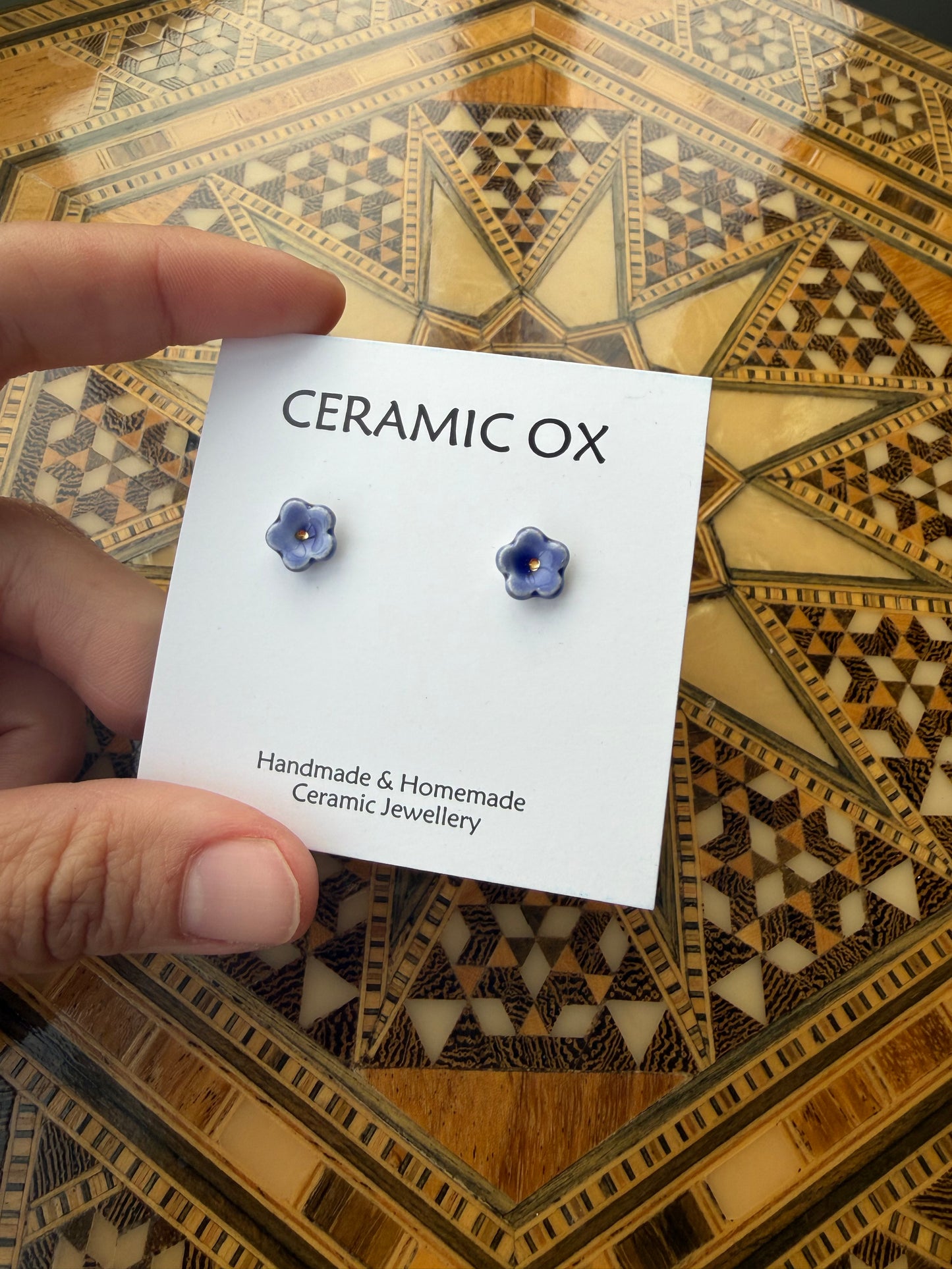 Tiny blue flower studs