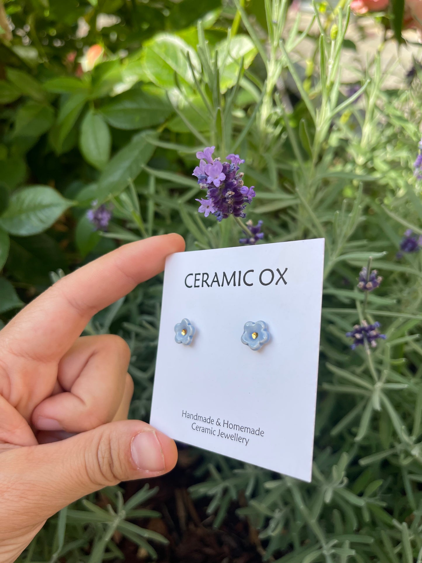 Tiny baby blue flower studs