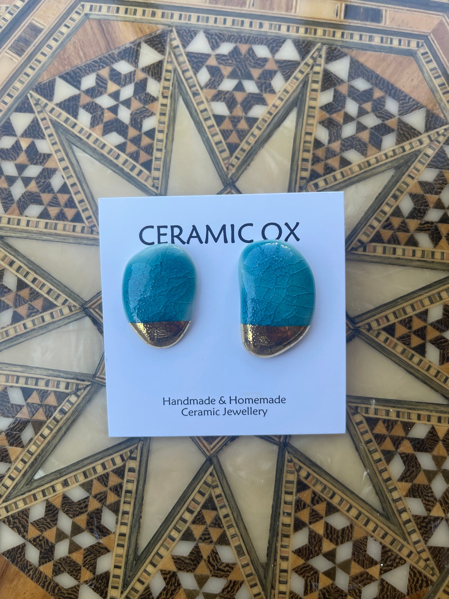 Aqua arched moulded studs