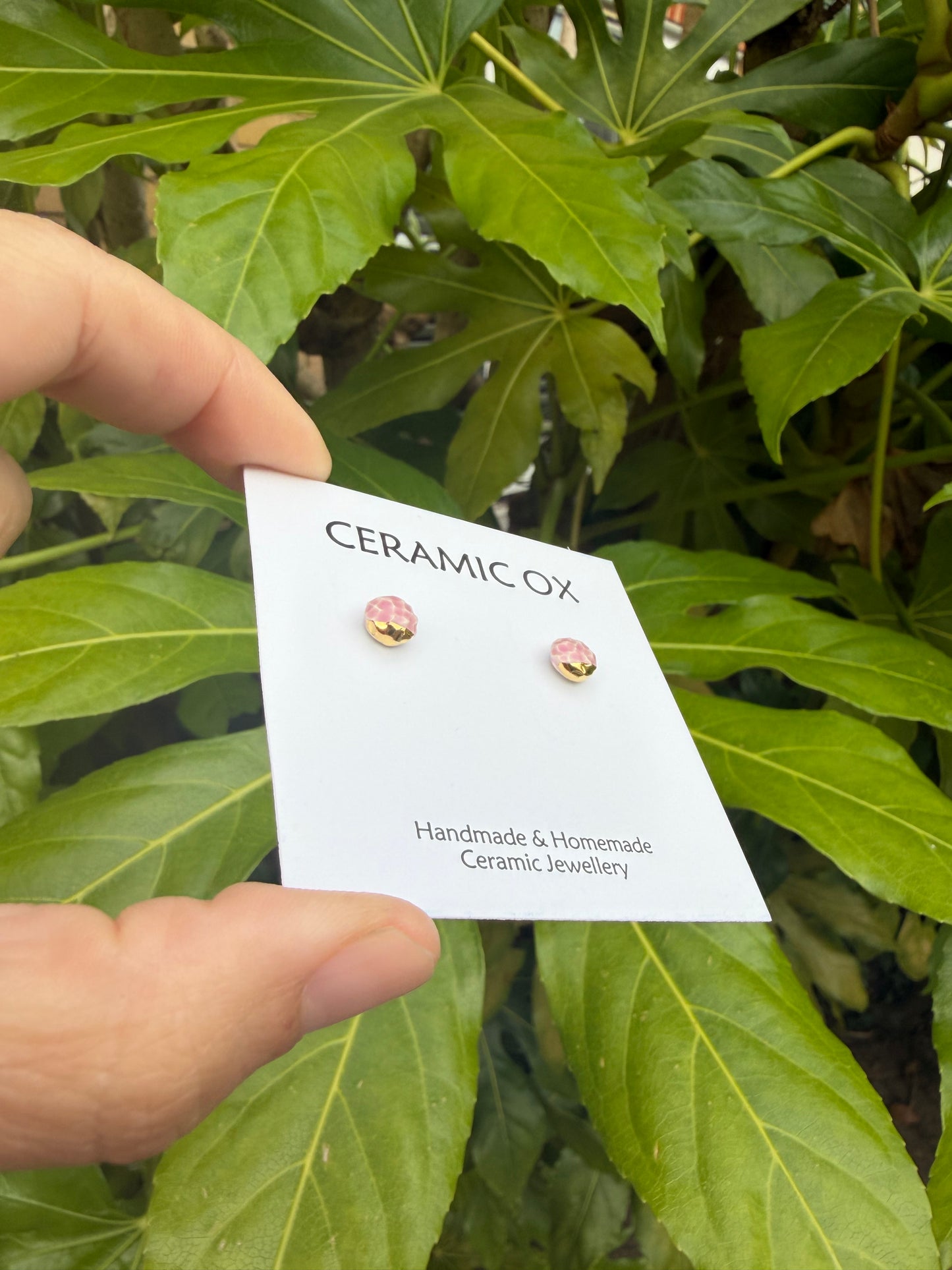 Tiny pink textured studs with gold accents