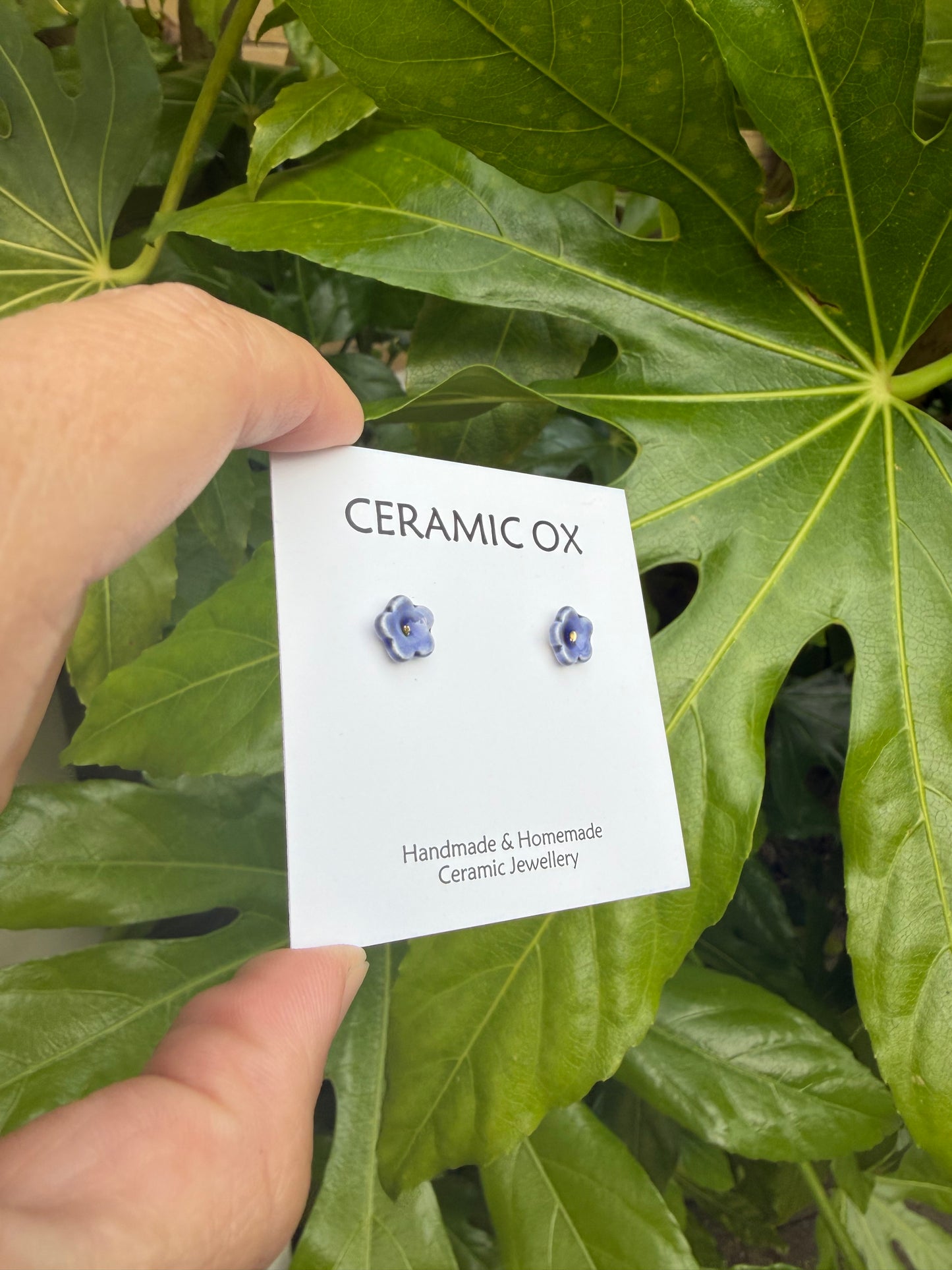 Tiny blue flower studs