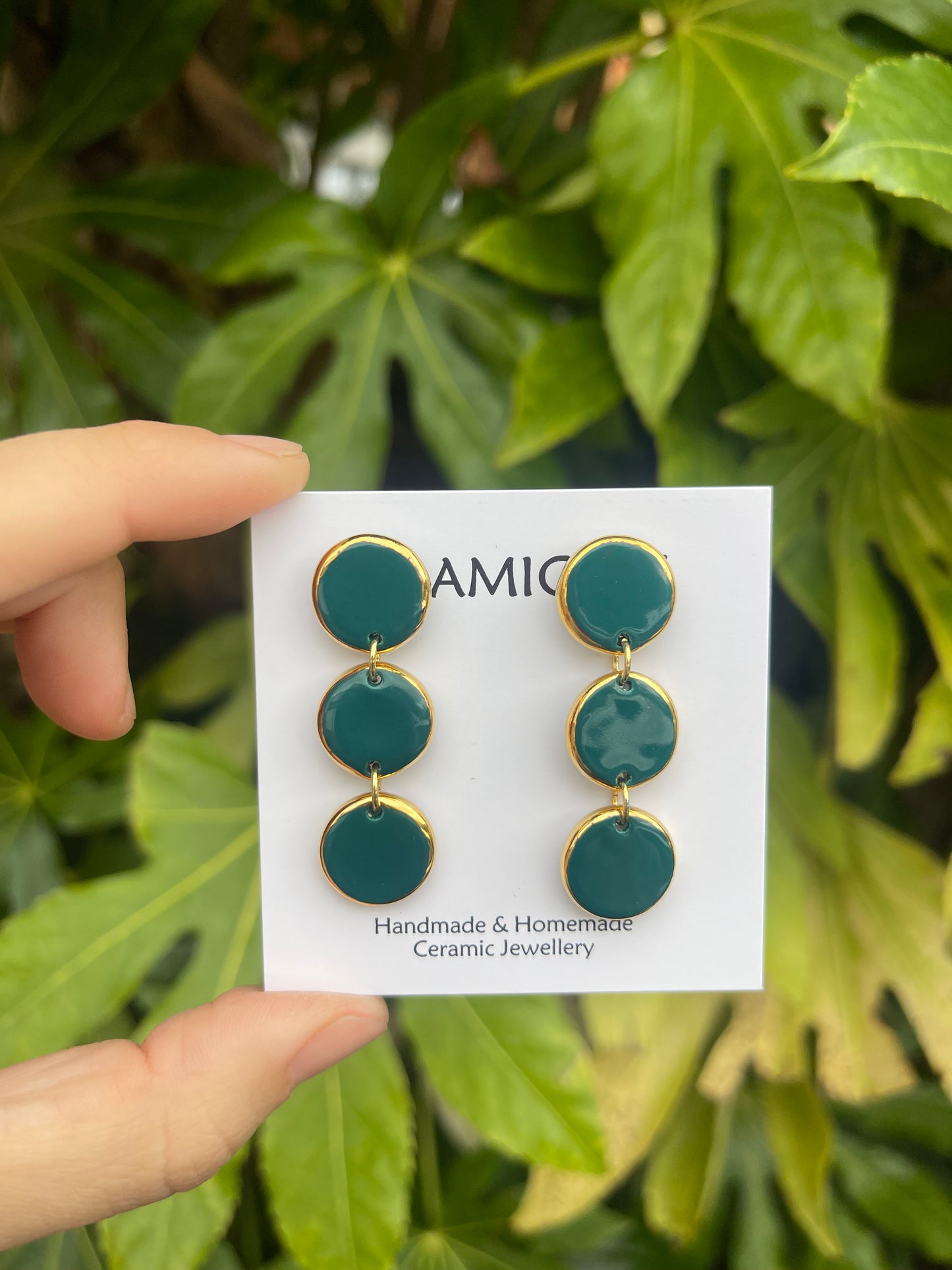 Teal green triple circle dangly studs