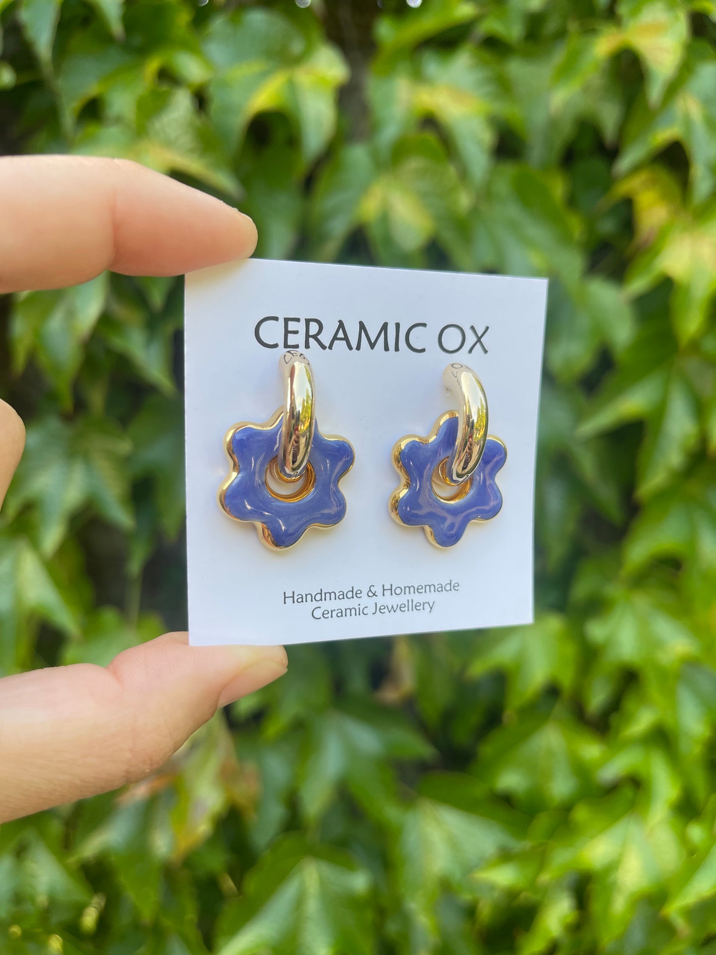 Blue flowers on chunky golden hoops