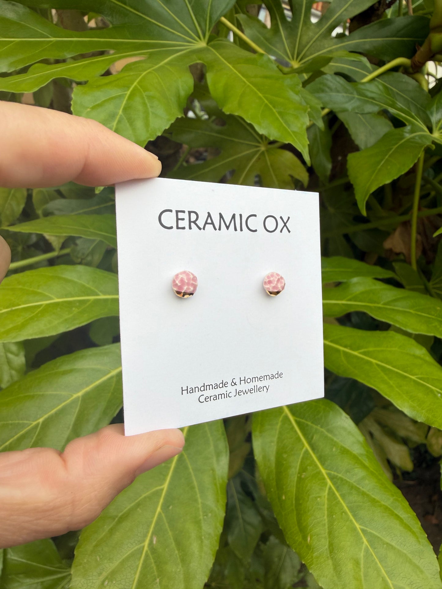 Tiny pink textured studs with gold accents