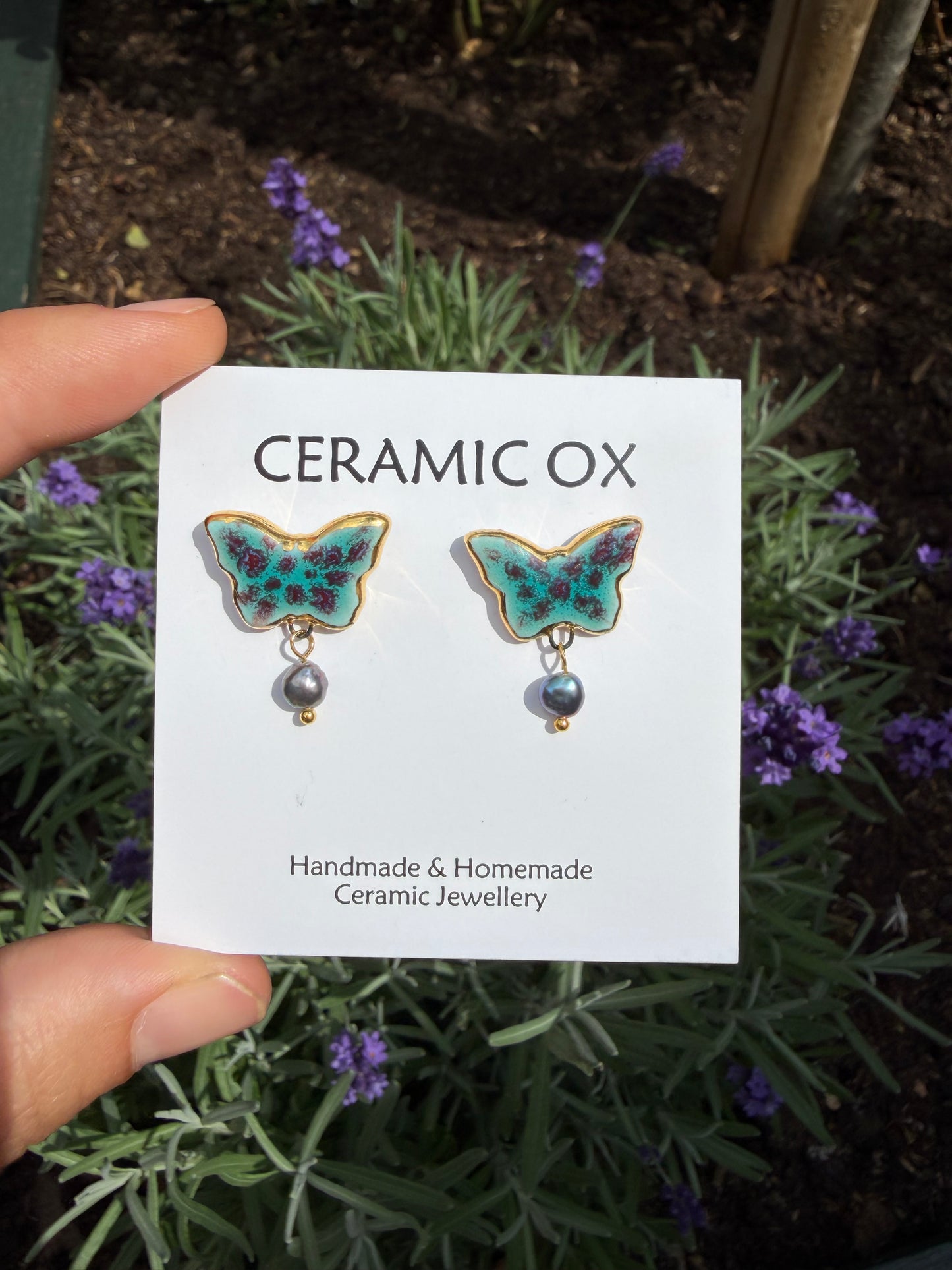 Speckled butterfly studs with grey fresh water pearls
