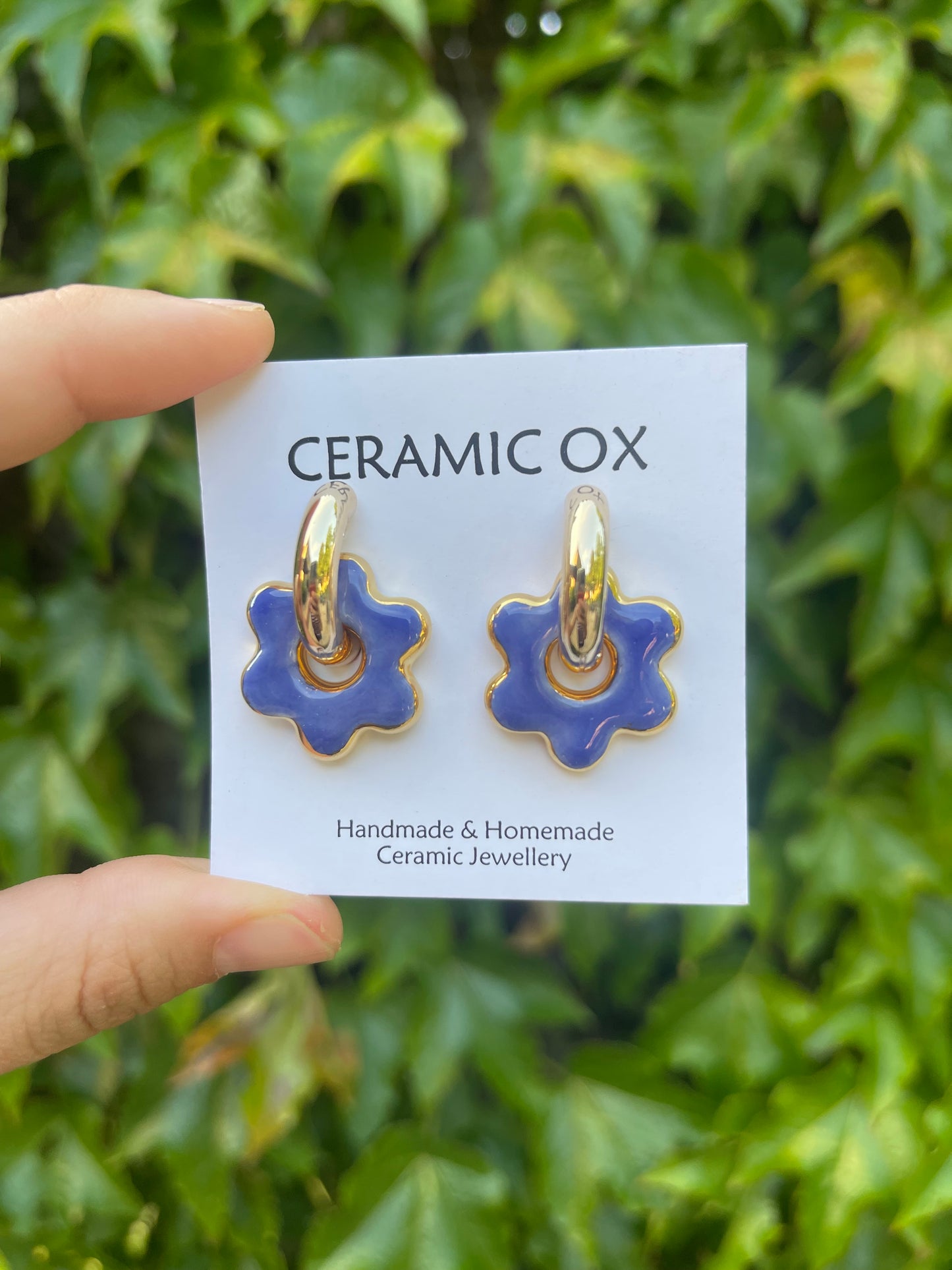 Blue flowers on chunky golden hoops