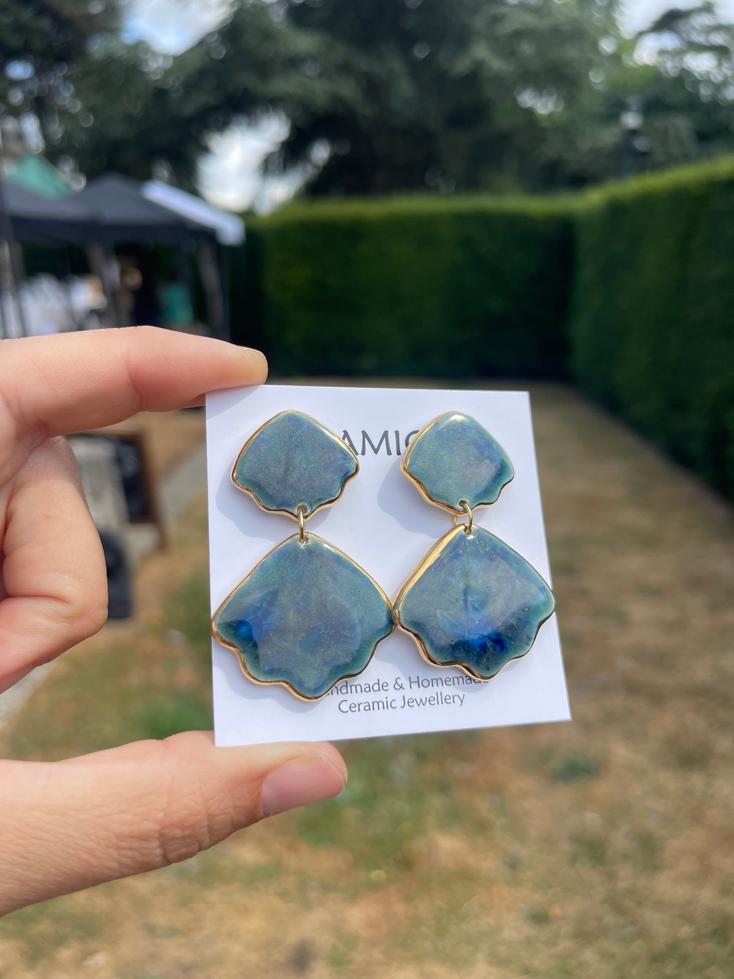 Double shell dangle studs