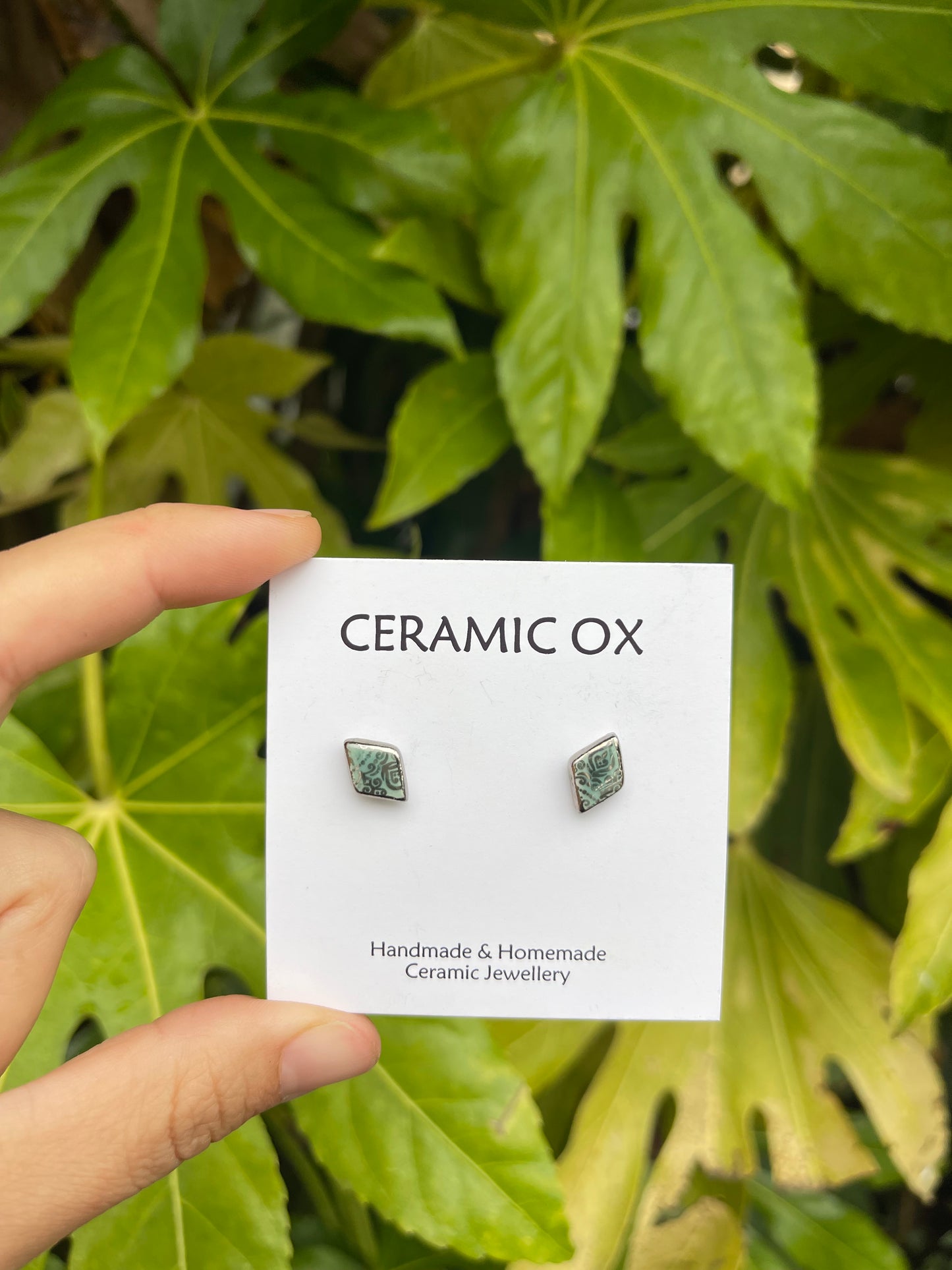 Tiny diamond studs with silver filigree style detailing