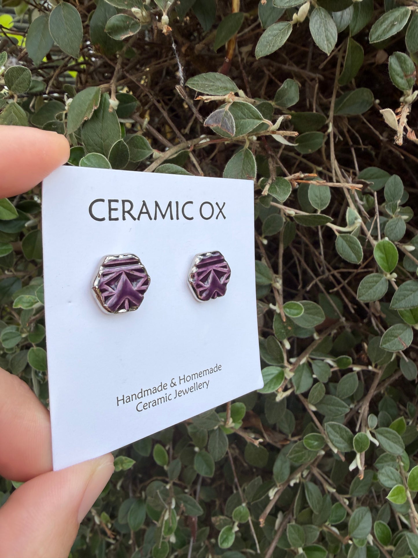 Royal purple hexagon geometric design studs with silver surround