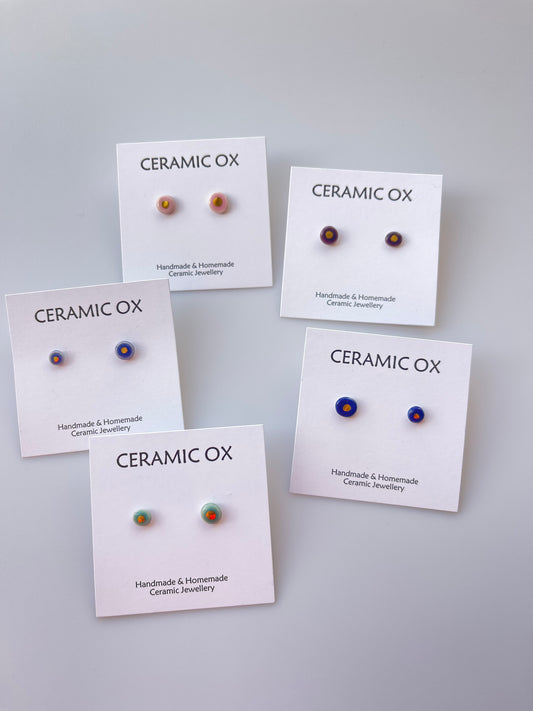 Tiny gold dot studs