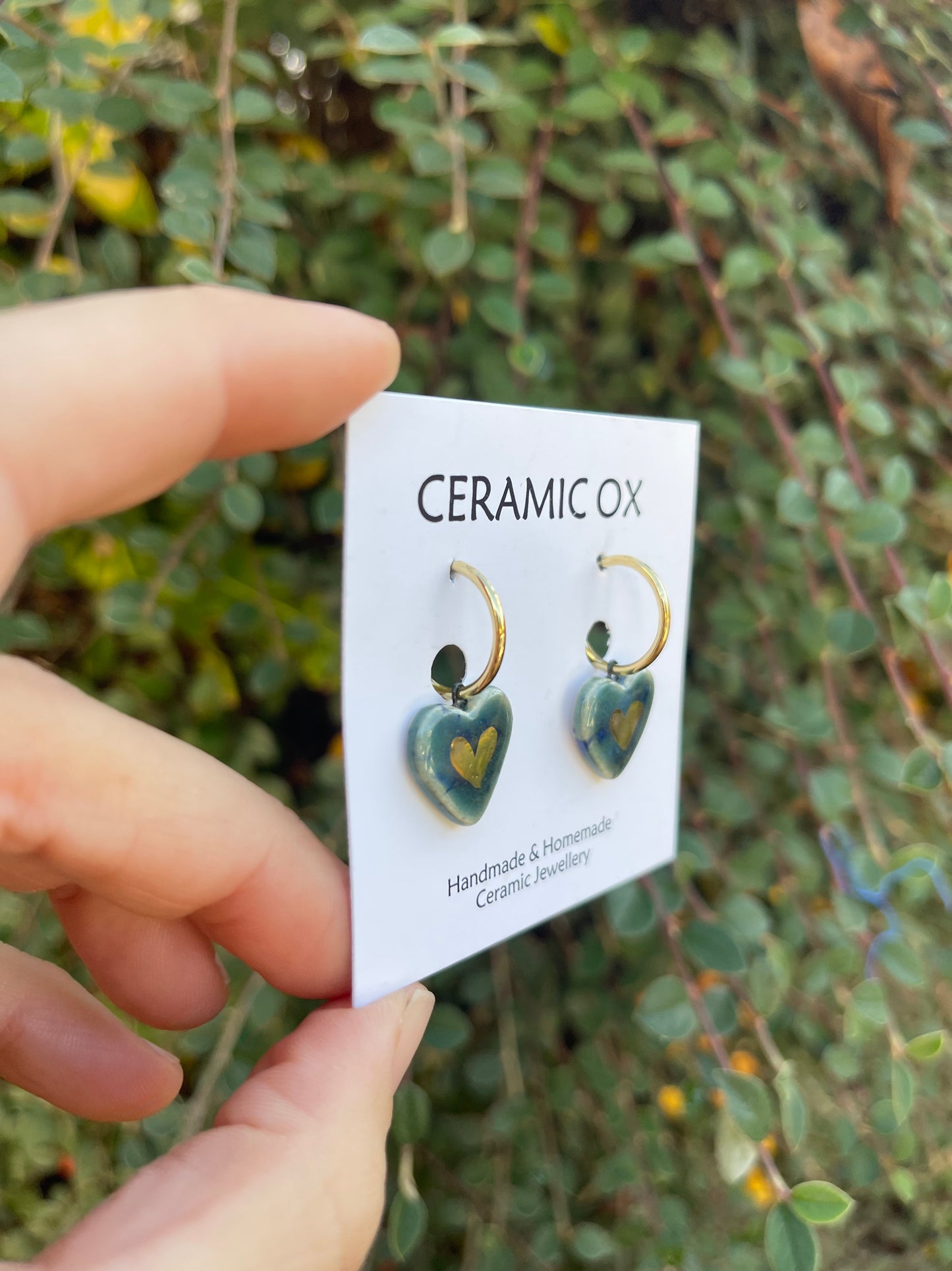 Heart danglies on hoop studs in Storm