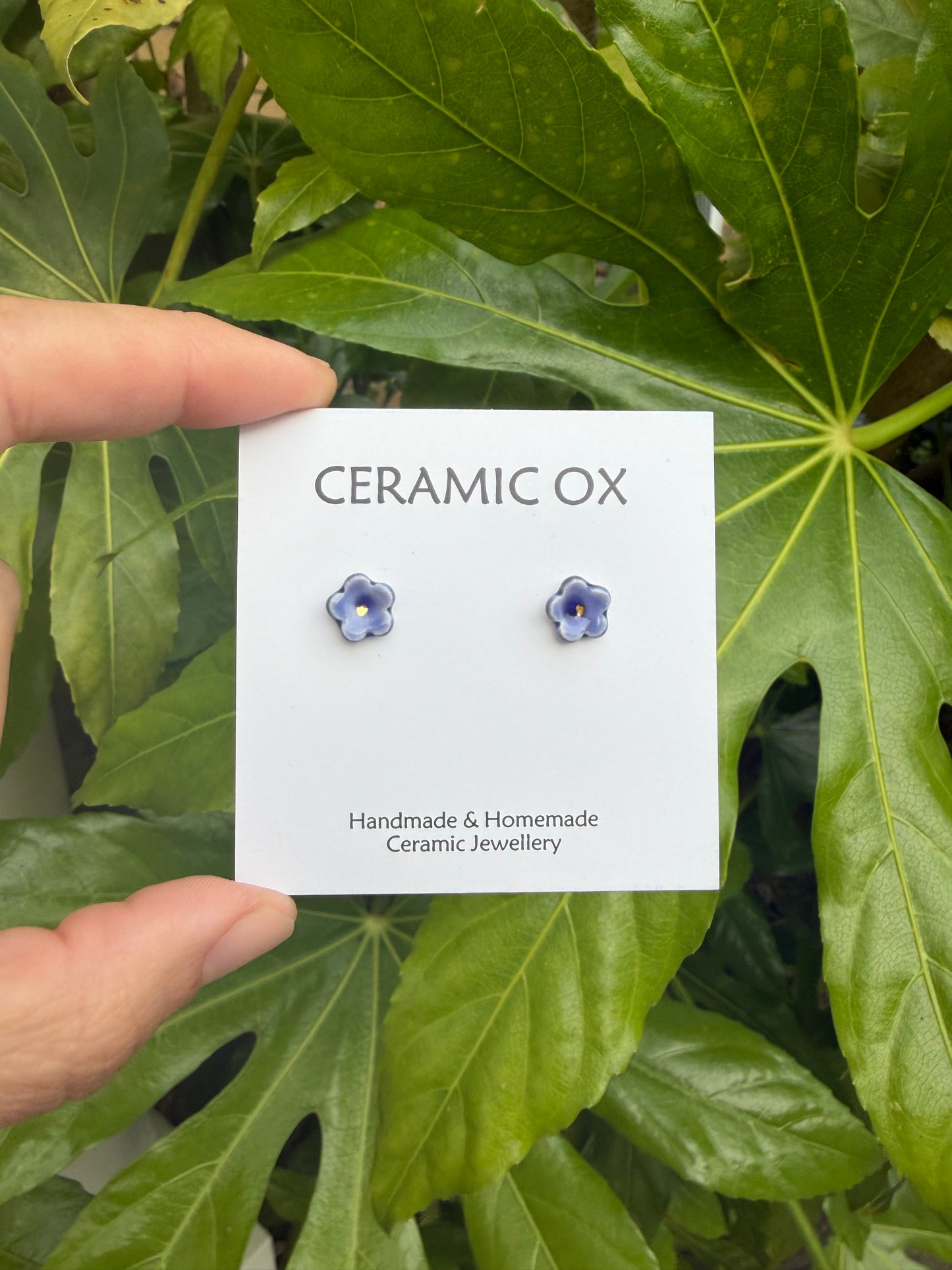 Tiny blue flower studs