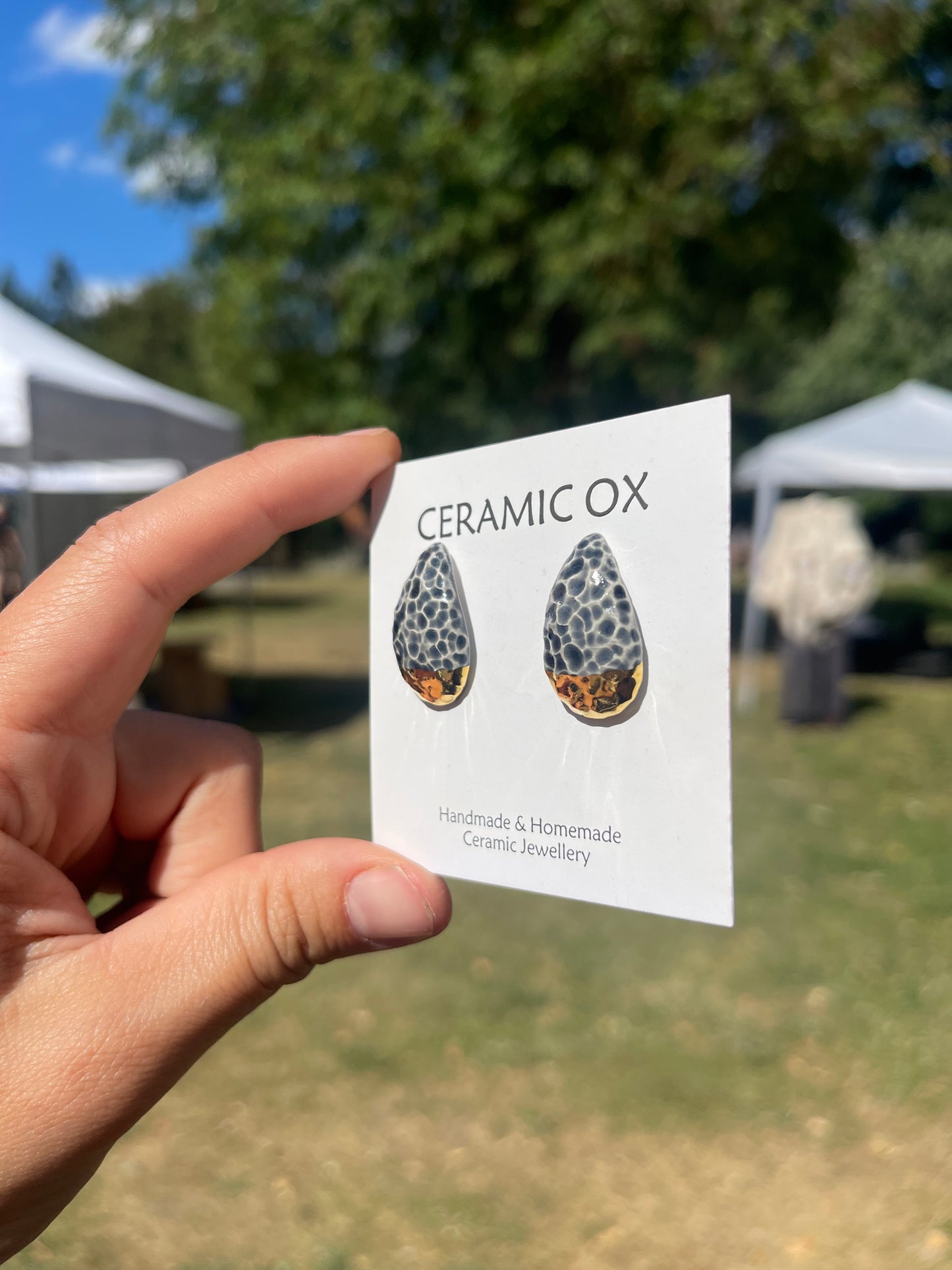 Textured teardrop convex studs in grey/black & gold dipped