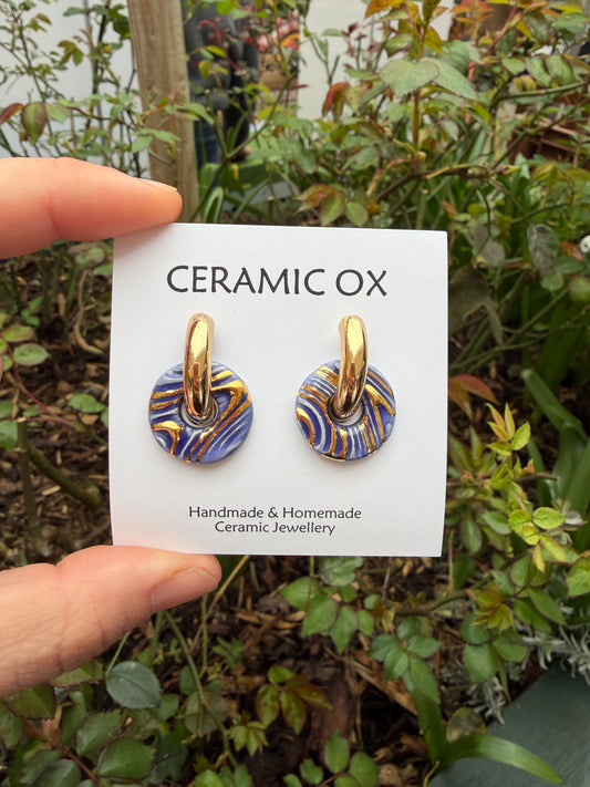 Fingerprint hoops in sapphire blue on chunky gold hoops