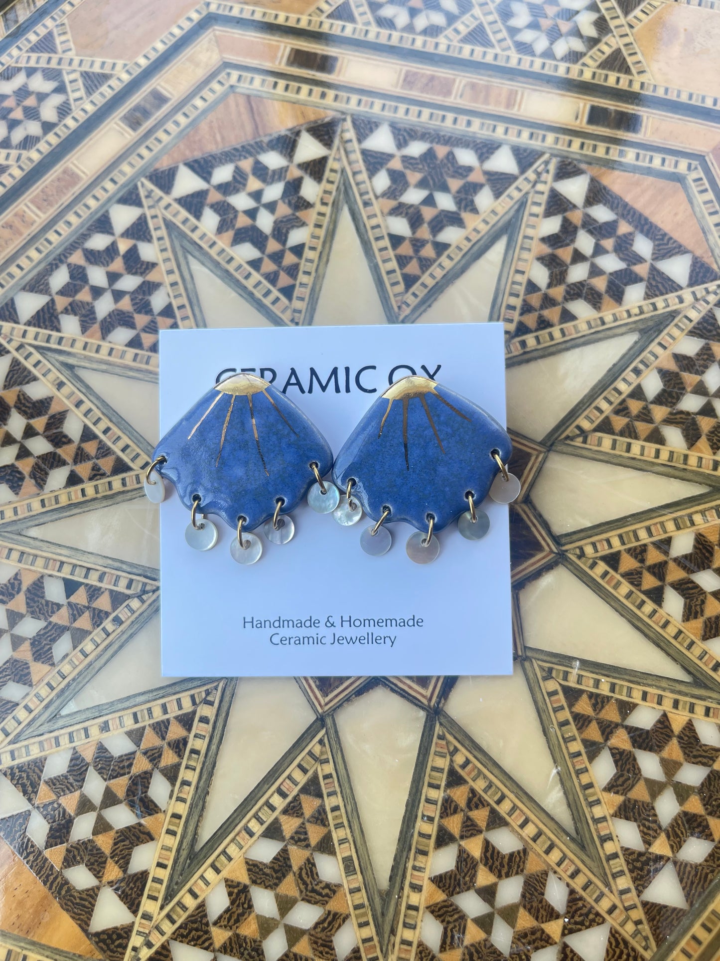 Shell studs with mother of pearl drops
