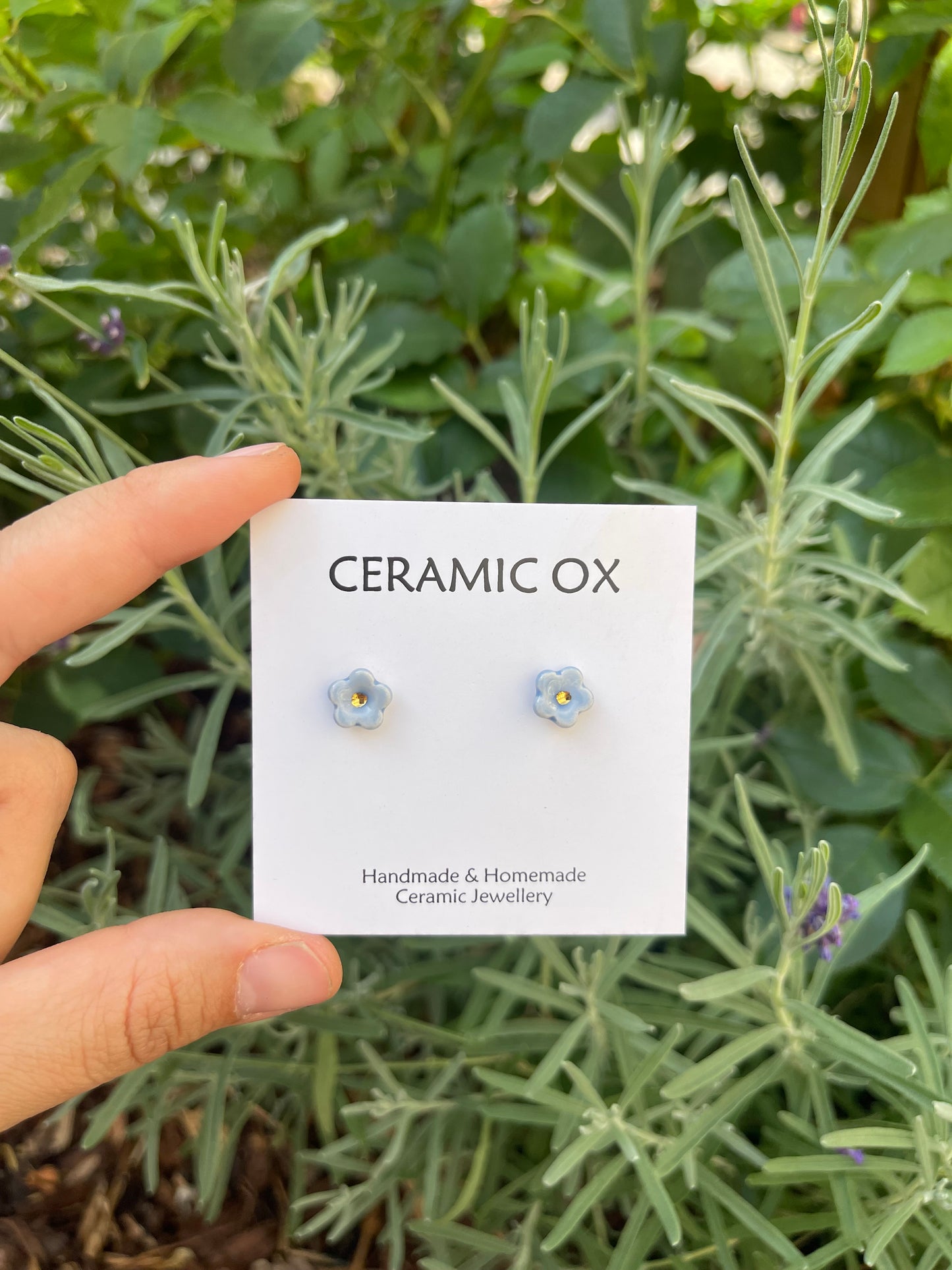 Tiny baby blue flower studs