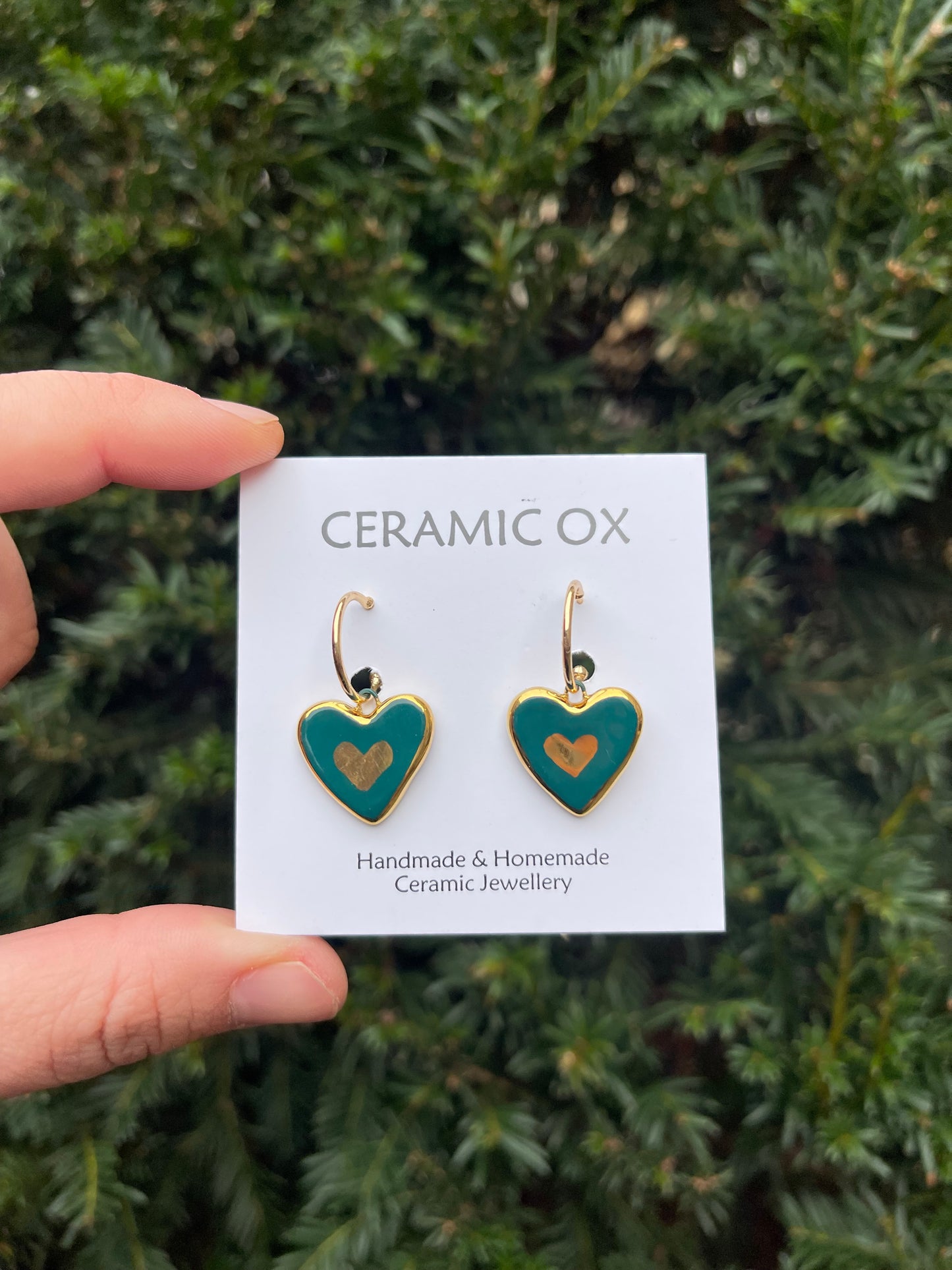 Greeny teal dangly hearts on hoops