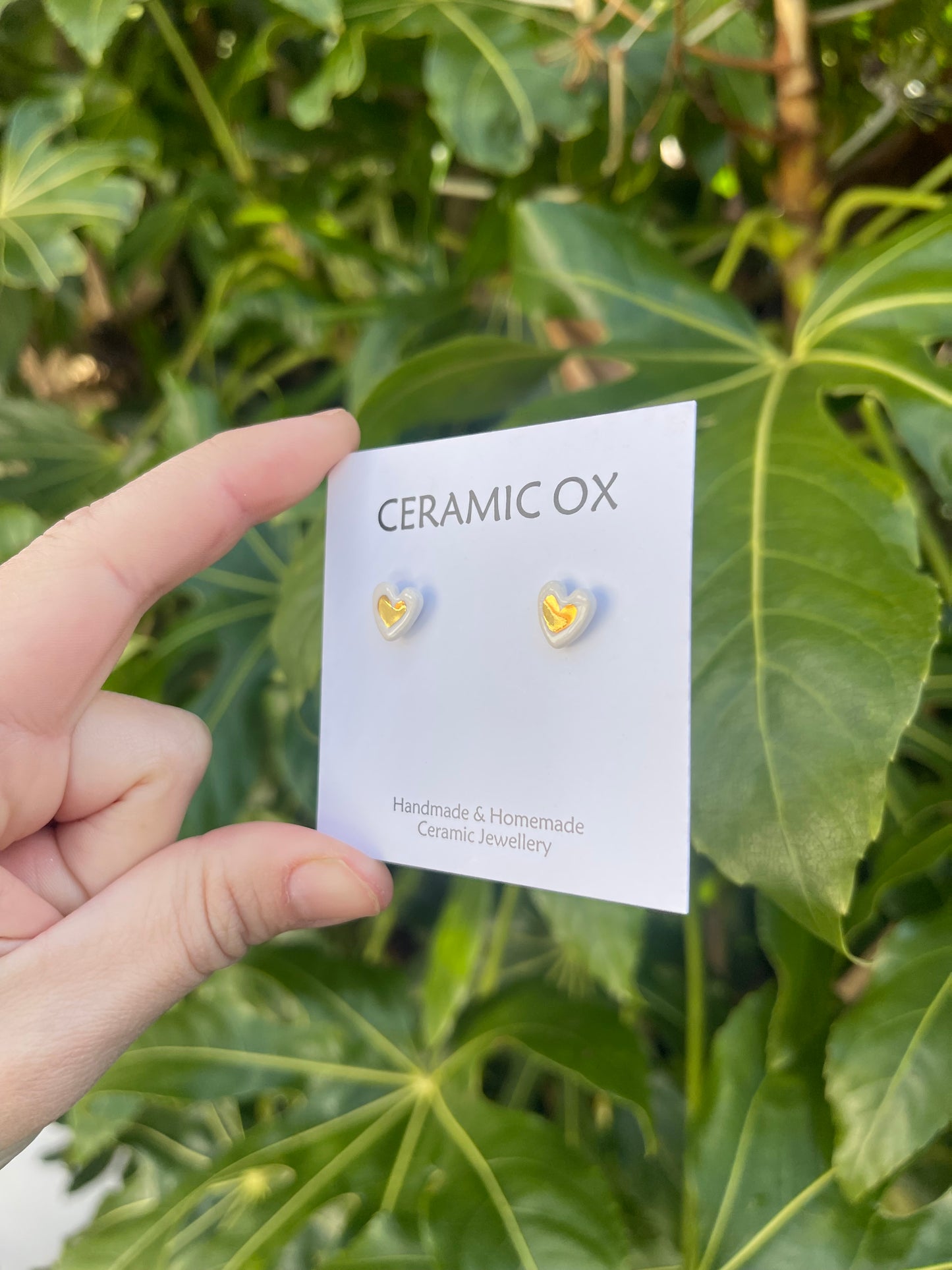 Tiny white heart studs