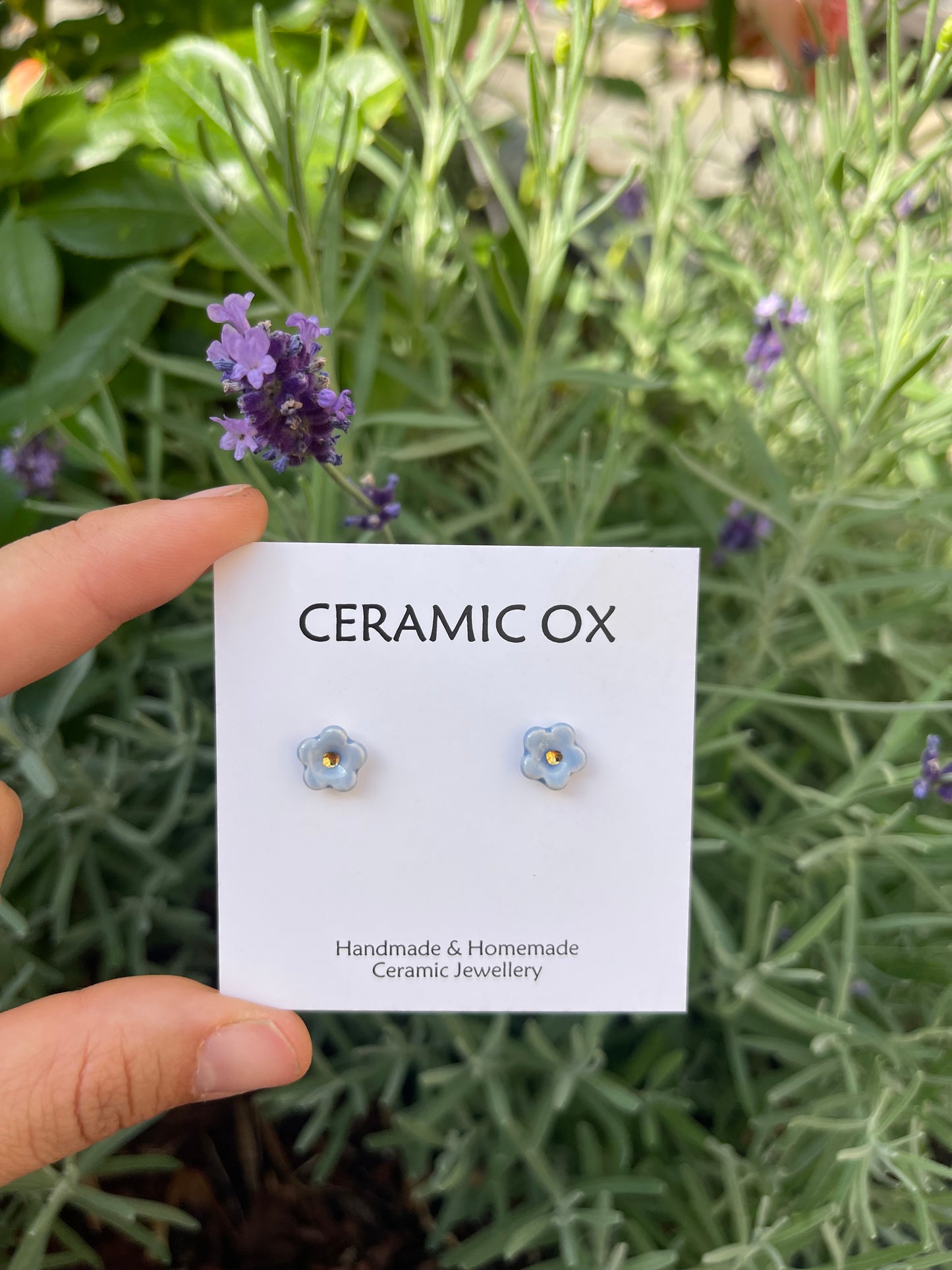 Tiny baby blue flower studs