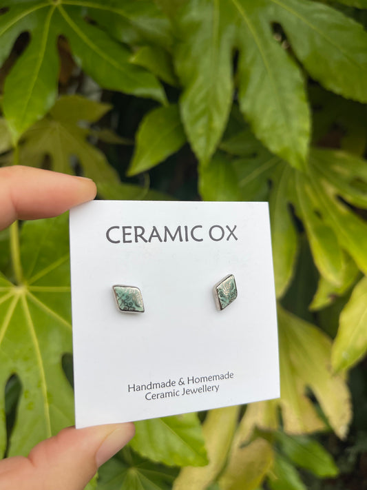 Tiny diamond studs with silver filigree style detailing