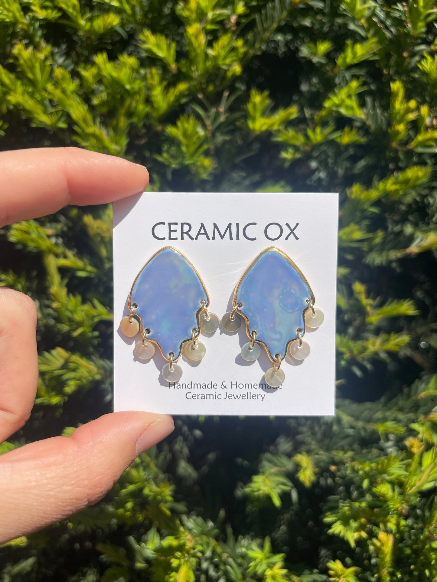 Mother of pearl studs with mother of pearl dangly discs