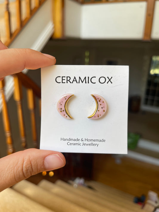 Pink crescent moon studs