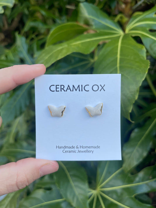 White butterfly studs