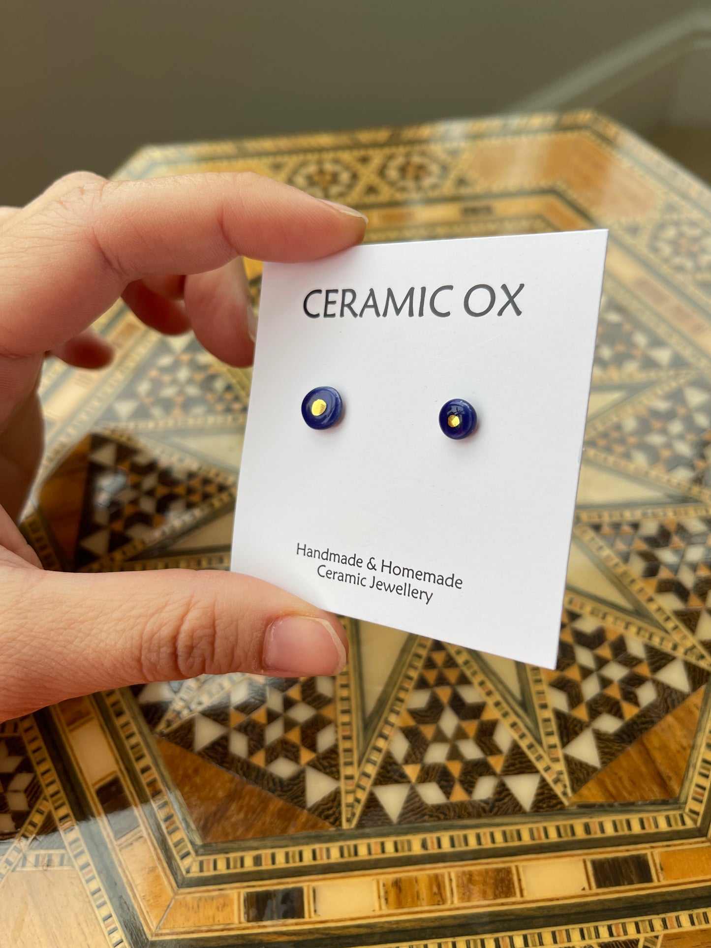 Tiny gold dot studs