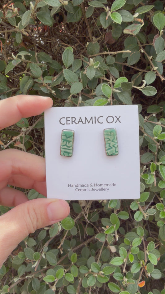 Emerald green block print rectangle studs with silver surround