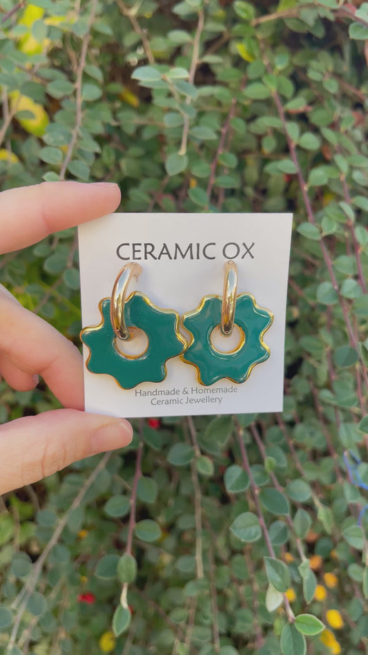 Puddle on chunky gold hoops in Teal