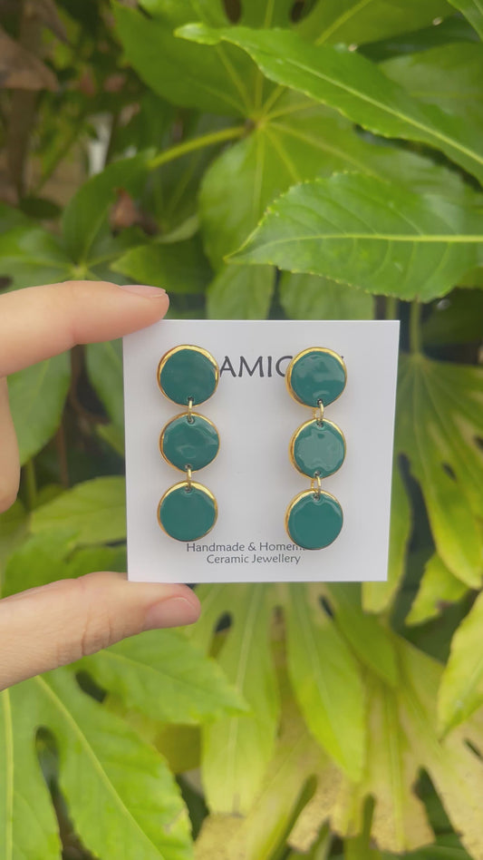 Teal green triple circle dangly studs