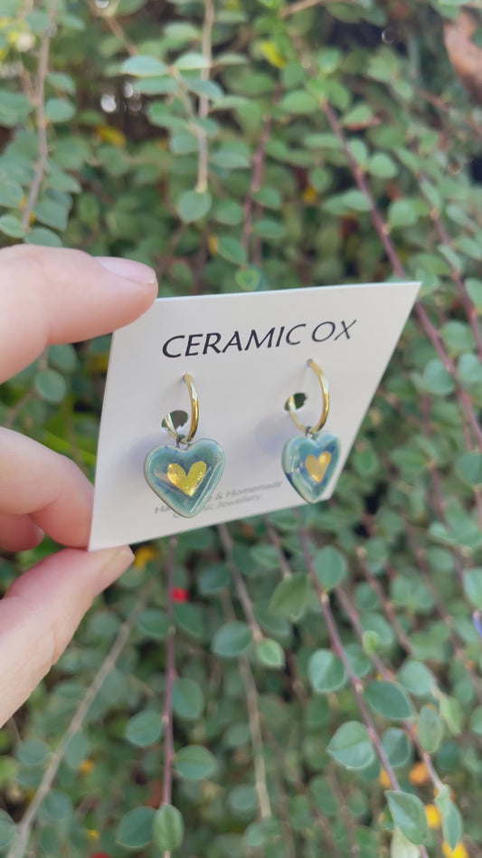 Heart danglies on hoop studs in Storm