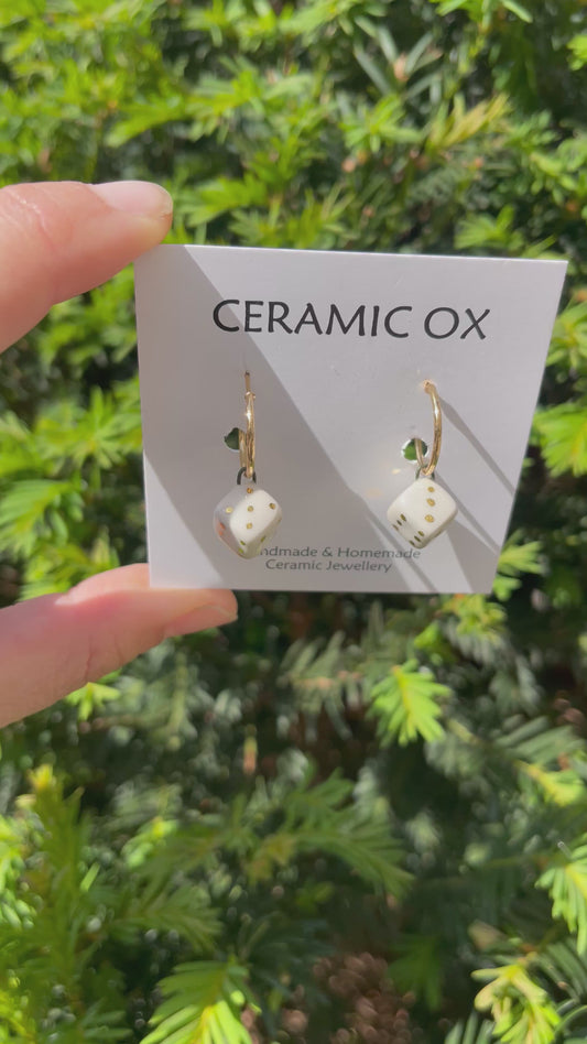 White dice on hoops